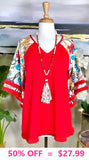 Red Top with white design bell sleeves and fringe trim