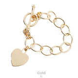 Gold chain bracelet with heart charm