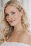 Gold Huggie earrings with heart charm