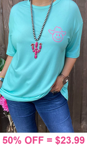 Turquoise tee with smiley cowgirl hat graphic