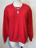 Red waffle knit with lace insets and criss cross neck