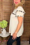 Cream top with leopard ruffle details