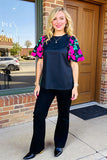Black top with floral puff sleeves