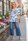 S, M, L, 3X White v-neck Over sized top with blue floral print.