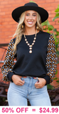 Black quilted top with geo print sleeves
