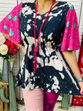 Black & White print op with pink turquoise heart bell sleeves
