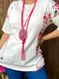 White top with pink floral sides