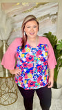 Blue Floral top with pink bell sleeves