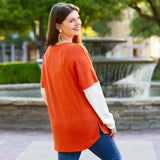 Orange ribbed long sleeve top white sleeves