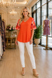 Orange top with chiffon sleeve