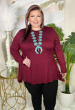 Maroon shark bite hem line top