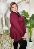 Maroon shark bite hem line top