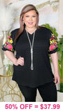 Black v-neck top with colorful embrodiery puff sleeves