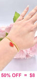Red Kiss charm gold beaded bracelet