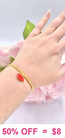 Red Kiss charm gold beaded bracelet