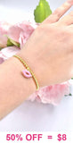 Pink Kiss charm gold beaded bracelet