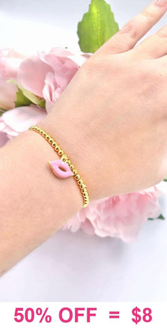 Pink Kiss charm gold beaded bracelet