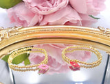 Pink Kiss charm gold beaded bracelet