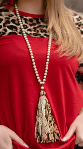 Pearl necklace with red shimmer, leopard tassel