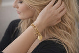 Gold chain bracelet with heart charm