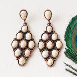 Cream diamond shape dangle earrings