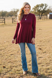 Maroon shark bite hem line top