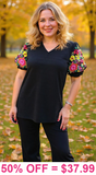 Black v-neck top with colorful embrodiery puff sleeves