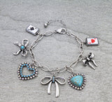 Charm bracelet with bows, hearts, cards