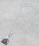 Silver pendant with turquoise & checkered print designs