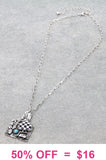 Silver tag with Checkered spade pendant
