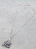 Silver tag with Checkered spade pendant