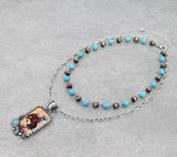 Double strand necklace with Bronc Rider pendant