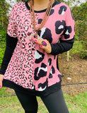 Pink leopard prints, black long sleeve top