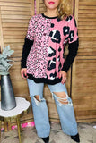 Pink leopard prints, black long sleeve top