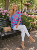 Blue top with pink floral print