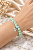 Mint beaded stretch bracelet with silver heart charm