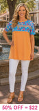 Orange top with blue floral and sequin stripe