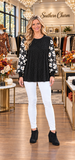 Black bling top with floral sleeves