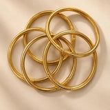 7 Stack gold glitter bangles