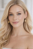 Gold Huggie earrings with heart charm