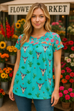 Turquoise steer print top with floral back