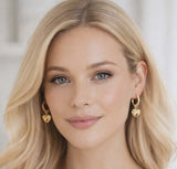 Gold Huggie earrings with heart charm